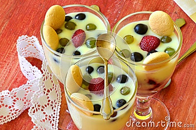 Hot homemade vanilla pudding with strawberries and vine berries Stock Photo