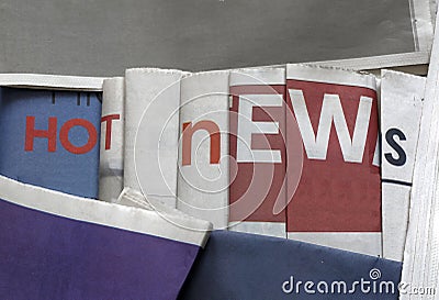 Hot news on newspapers background Stock Photo