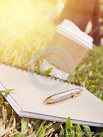 Hot paper cup of coffee and notebook 1 Stock Photo