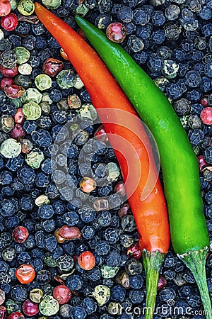 Hot pepper close-up contrasting green red background peppercorn seasoning asia thailand vietnam curry Stock Photo