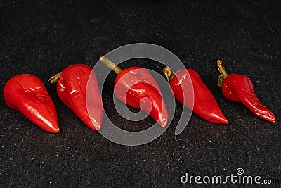 Hot pickled pepper on grey stone Stock Photo