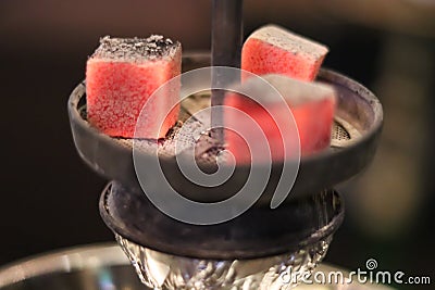 Lighted hookah coals close up. Stock Photo