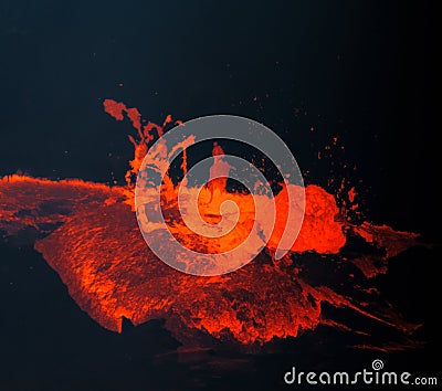 Hot, red, molten lava bubbles to the surface in Hawaii Stock Photo