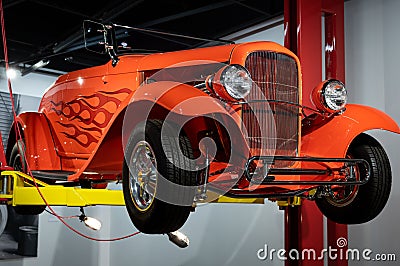 Detail of orange hot rod in the workshop elevator 1932 Ford Model 18 Roadster "Orange Twist" Editorial Stock Photo