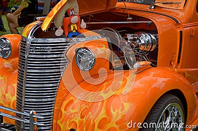 Hot rods are old classic American cars with large engines modified for linear speed. Editorial Stock Photo