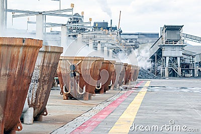 Hot slags in the melting pots in the copper processing factory. Copper slag is a by-product of copper extraction by smelting. Stock Photo