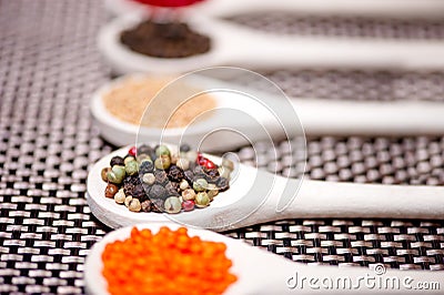 Hot spices flavors mix with black pepper, pepper corns Stock Photo