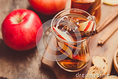 Hot spicy beverage. Hot drink apple tea, punch with cinnamon s Stock Photo