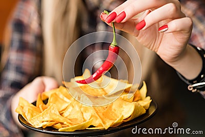 Hot spicy chips food snack crisps chili pepper Stock Photo