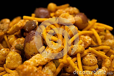 Hot spicy NavRatan mixture snacks in full-frame, made with, potato chips, peanuts, besan sev spicy snacks (Namkeen) Stock Photo