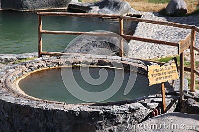 Hot spring water with warning sign Stock Photo