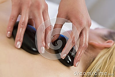 Hot Stone Massage Stock Photo