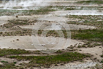 Hot sulfurous gases emerge from a fumarole hot spring in Yellowstone National Park Stock Photo