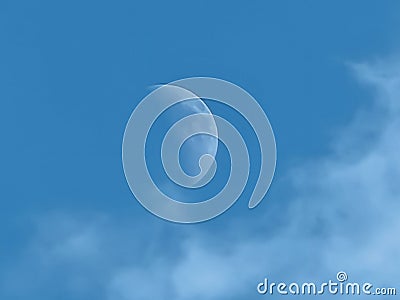 A hot summer day with a lovely view of the bright moon. Stock Photo