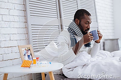 Quiet responsible patient drinking hot tea Stock Photo