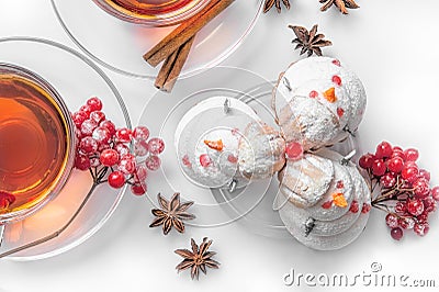 Hot tea on Christmas in glass transparent Cup with tea tree and cakes in the shape of snowmen out of meringue, cinnamon Stock Photo