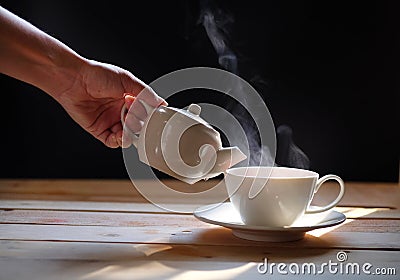 Hot tea cup on wood background.Hot drink. Stock Photo