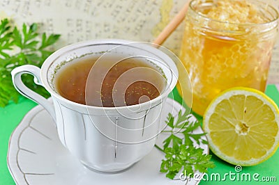 Hot tea with parsley, lemon and honey Stock Photo