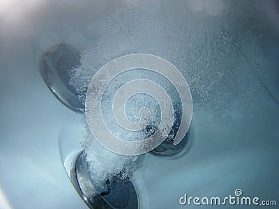 Hot tub jets under water Stock Photo