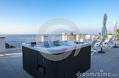 Hot Tub in a Resort Roof Top Overlooking Mount Vesuvius and the Mediterranean Sea Stock Photo