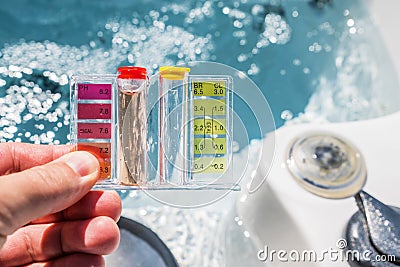 Hot Tub Water Quality Check by Using Chemical Testing Kit Stock Photo