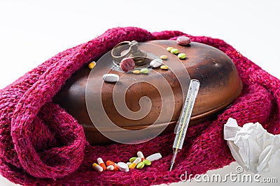 Hot water bottle,scarf, thermometer, pills, tissue Stock Photo