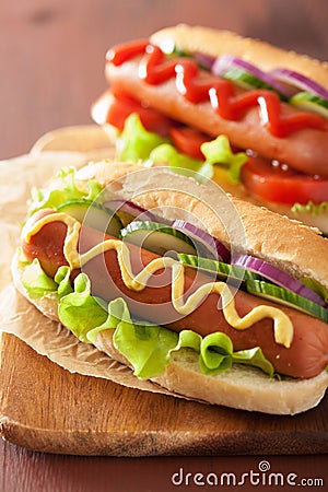 Hotdog with ketchup mustard and vegetables Stock Photo