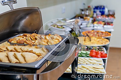 Hotel breakfast board in a family hotel. Buffet with different dishes. Stock Photo