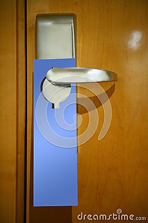 Hotel door handle with a copy space note Stock Photo