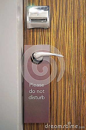 Hotel door with the inscription does not disturb Stock Photo