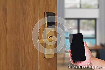 Hotel door security Unlocking by application on mobile phone. Digital door lock, key less system of access door. Stock Photo