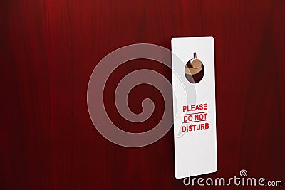 Hotel door with sign please do not disturb Stock Photo