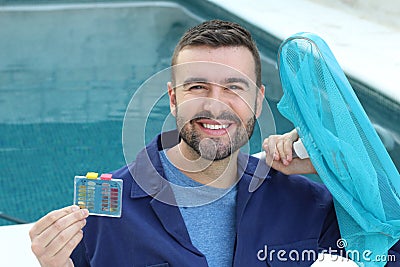 Hotel employee cleaning swimming pool Stock Photo