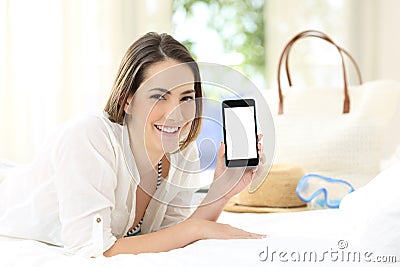 Hotel guest showing a blank smart phone screen Stock Photo