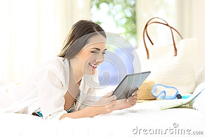 Hotel guest using a tablet on summer vacations Stock Photo