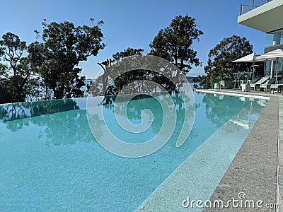 Hotel Infinity Pool Overlooking The Ocean Stock Photo