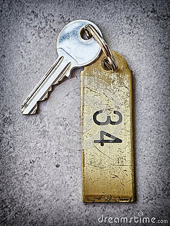 Hotel key with the key chain number 34. Stock Photo