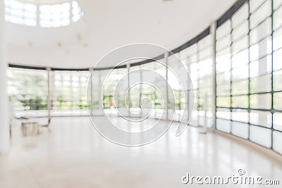 Hotel or office building lobby blur background interior view toward reception hall, modern luxury white room space with blurry Stock Photo