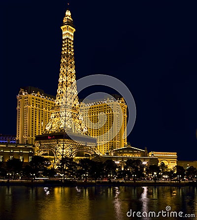 Hotel Paris and replica of Eiffel Tower at night in Las Vegas Editorial Stock Photo