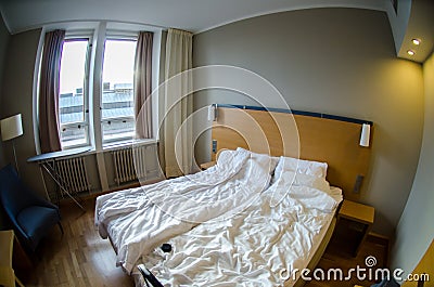 Hotel room with messed-up bed Stock Photo