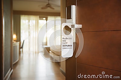 Hotel room with please do not disturb sign Stock Photo