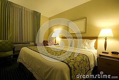 Hotel room with queen size bed Stock Photo