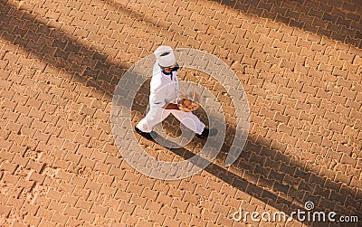 Hotel room service staff man carrying food Editorial Stock Photo