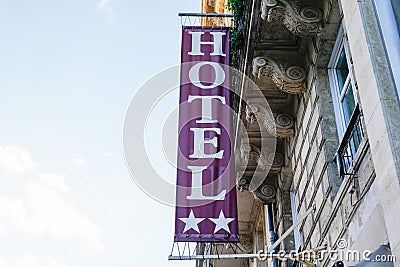 Hotel sign text two stars in wall building facade in french tourist city Stock Photo