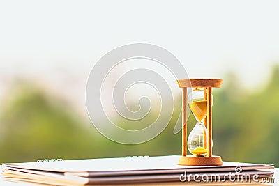 Hour glass on calendar concept for time slipping away for important appointment date. Stock Photo