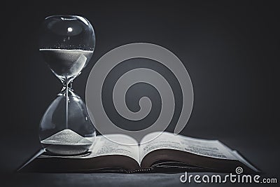 Hourglass on a Bible Stock Photo