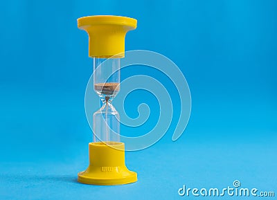 Hourglass on blue background Stock Photo