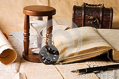 Hourglass and the book - vintage Stock Photo