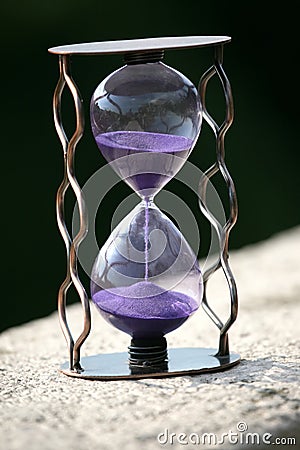 Hourglass counting down the time remaining Stock Photo