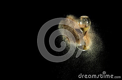 Hourglass fly in mid air, add more sand of time on gold sand over black background. Brown hourglass show more time Deadline Stock Photo